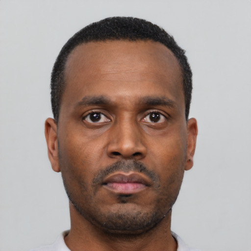 Neutral black young-adult male with short  black hair and brown eyes