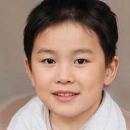 Joyful white child female with short  brown hair and brown eyes