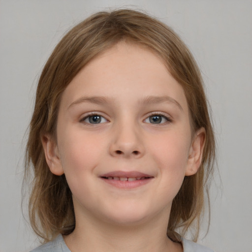 Joyful white child female with medium  brown hair and blue eyes