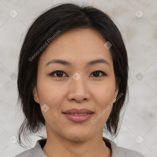 Joyful asian young-adult female with medium  brown hair and brown eyes