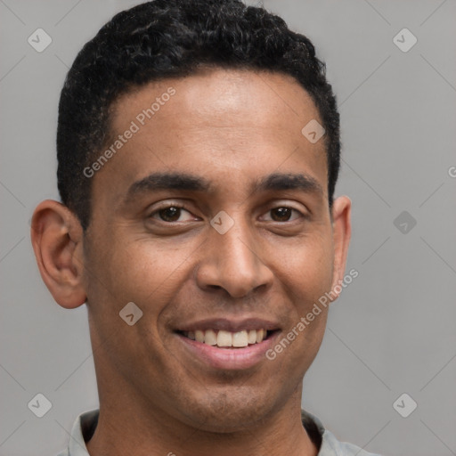 Joyful latino young-adult male with short  brown hair and brown eyes