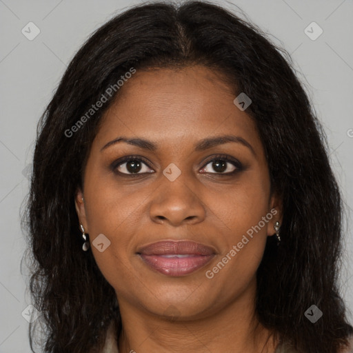 Joyful black young-adult female with long  brown hair and brown eyes