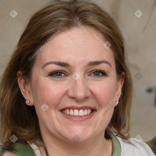 Joyful white adult female with medium  brown hair and blue eyes