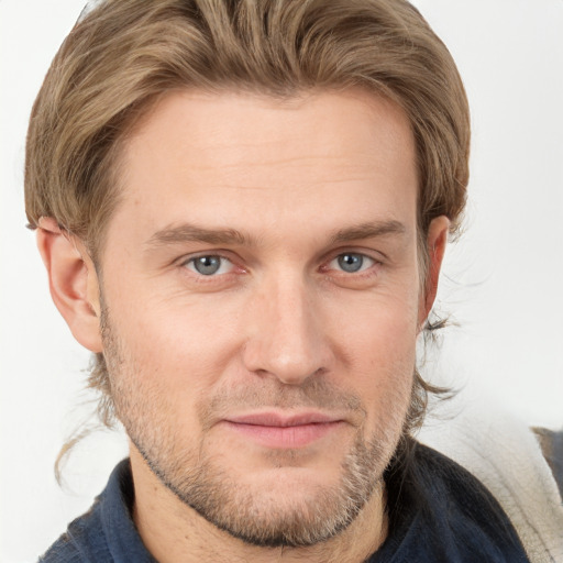 Joyful white adult male with short  brown hair and grey eyes