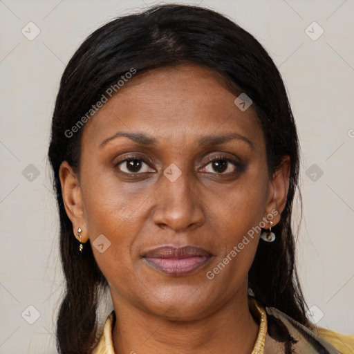Joyful black adult female with medium  brown hair and brown eyes