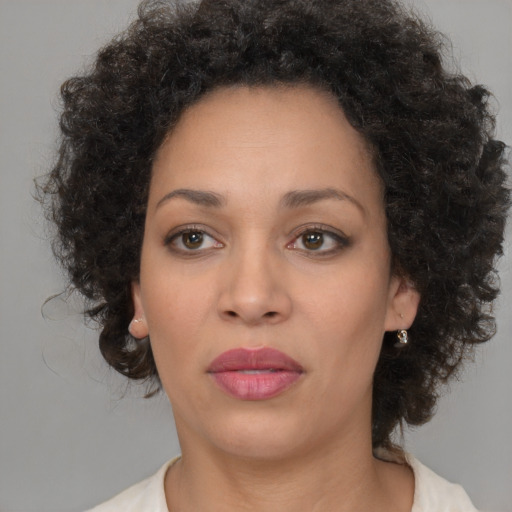 Neutral black adult female with medium  brown hair and brown eyes
