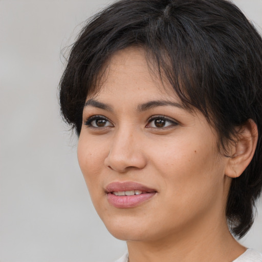 Joyful white young-adult female with medium  brown hair and brown eyes