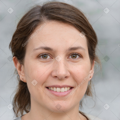 Joyful white adult female with medium  brown hair and grey eyes