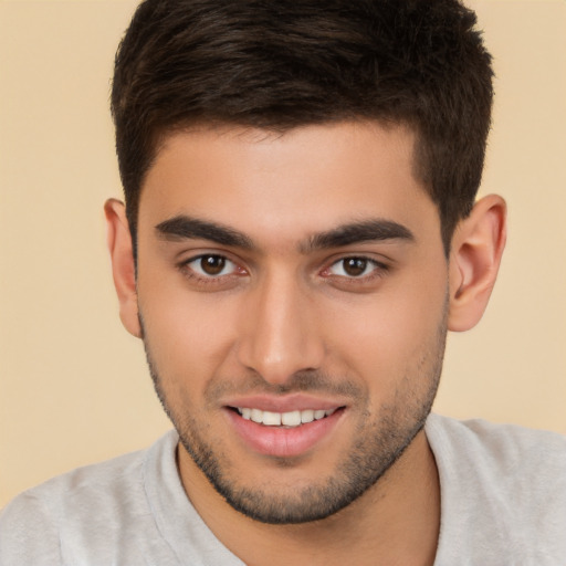 Joyful white young-adult male with short  brown hair and brown eyes