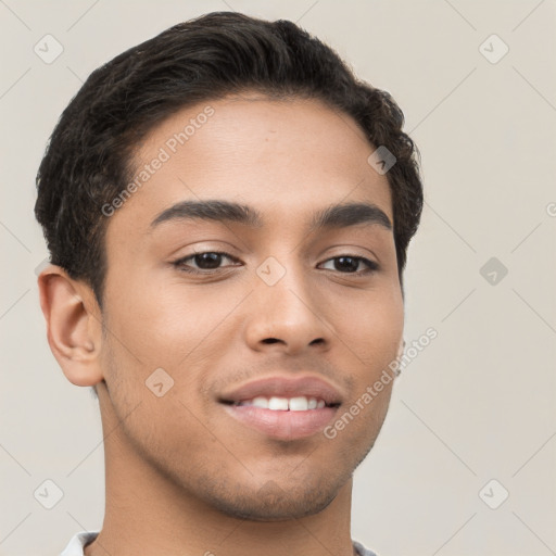 Joyful latino young-adult male with short  brown hair and brown eyes