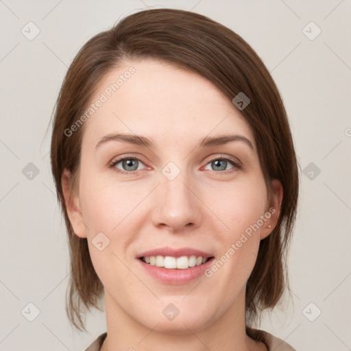 Joyful white young-adult female with medium  brown hair and grey eyes