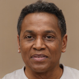 Joyful black adult male with short  brown hair and brown eyes