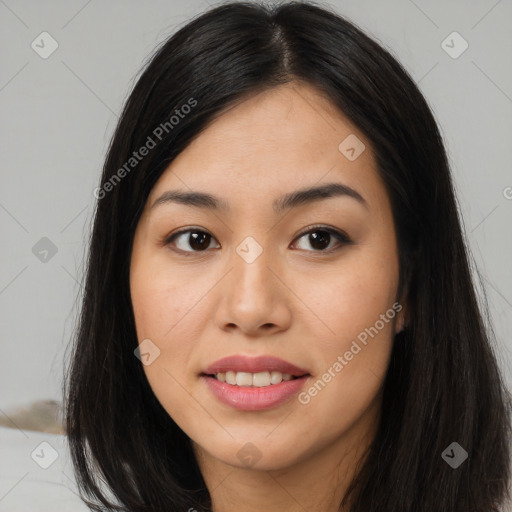 Joyful asian young-adult female with long  black hair and brown eyes