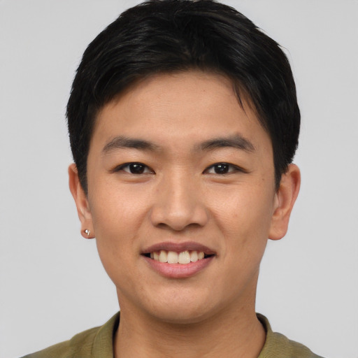 Joyful asian young-adult male with short  black hair and brown eyes