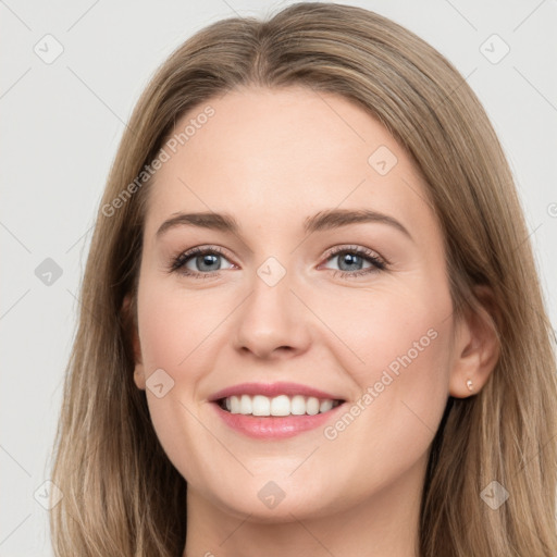 Joyful white young-adult female with long  brown hair and green eyes