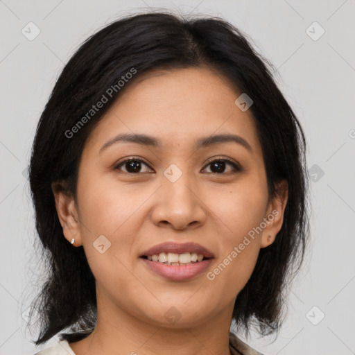 Joyful latino young-adult female with medium  brown hair and brown eyes