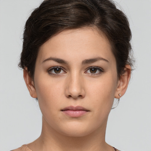 Neutral white young-adult female with short  brown hair and brown eyes