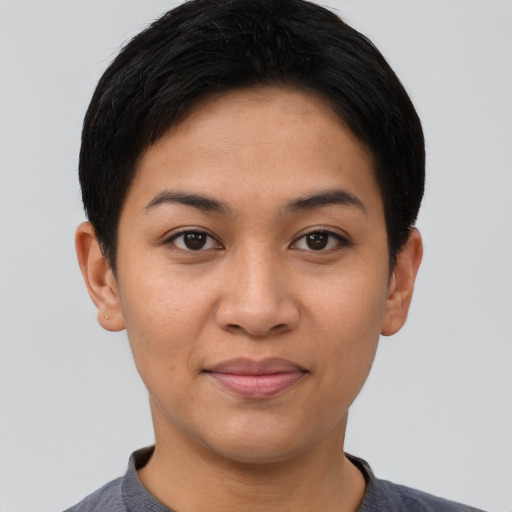 Joyful asian young-adult female with short  black hair and brown eyes