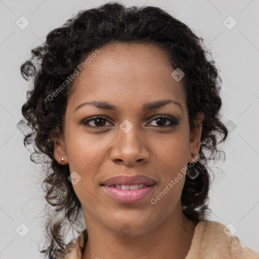 Joyful black young-adult female with long  brown hair and brown eyes