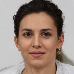 Joyful white adult female with short  brown hair and brown eyes