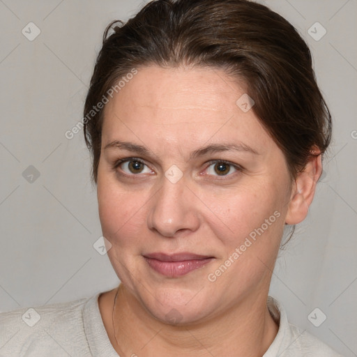 Joyful white adult female with medium  brown hair and grey eyes