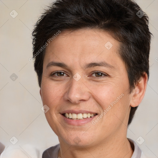 Joyful white adult female with short  brown hair and brown eyes