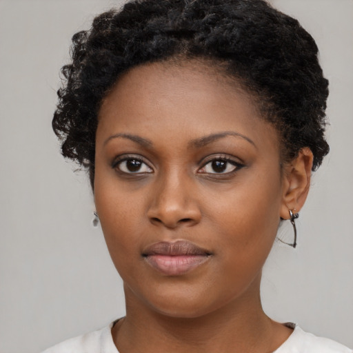 Neutral black young-adult female with short  brown hair and brown eyes