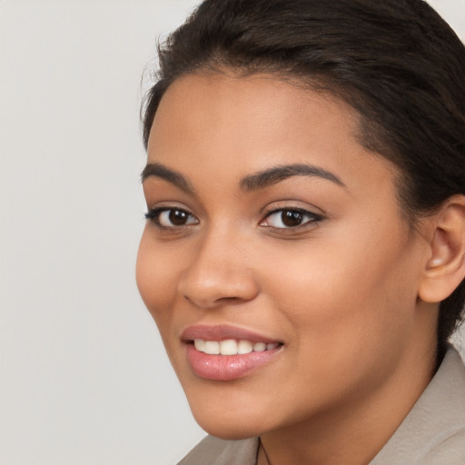 Joyful latino young-adult female with long  brown hair and brown eyes