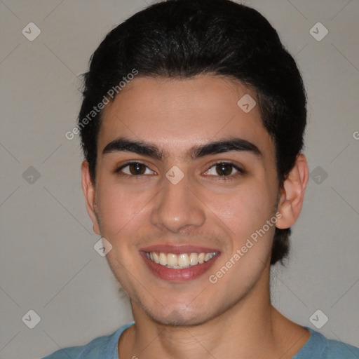 Joyful white young-adult male with short  brown hair and brown eyes