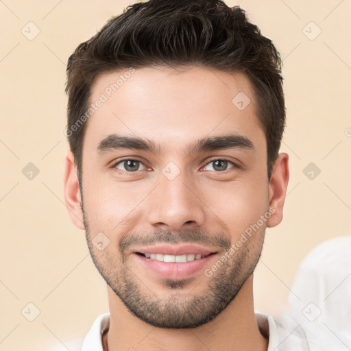 Joyful white young-adult male with short  brown hair and brown eyes