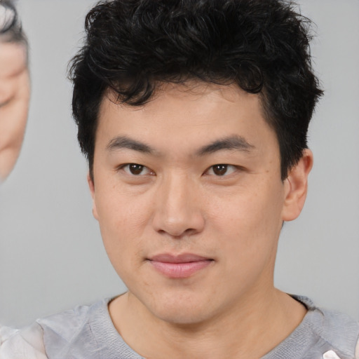 Neutral asian young-adult male with short  black hair and brown eyes