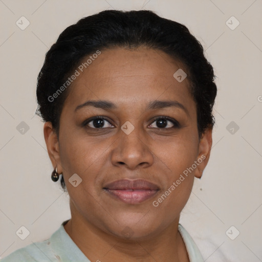 Joyful black adult female with short  brown hair and brown eyes