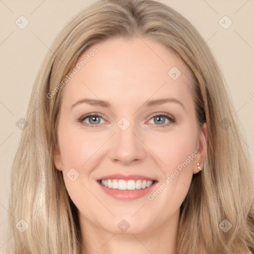 Joyful white young-adult female with long  brown hair and blue eyes