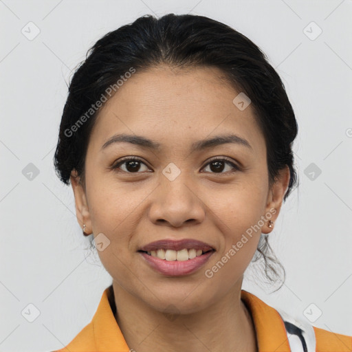 Joyful latino young-adult female with medium  brown hair and brown eyes