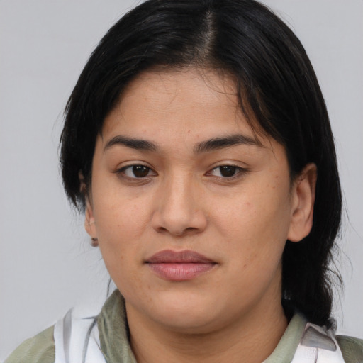 Joyful asian young-adult female with medium  brown hair and brown eyes