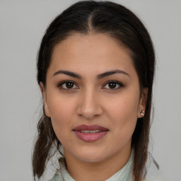 Joyful white young-adult female with medium  brown hair and brown eyes