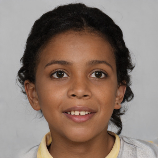 Joyful black child female with medium  brown hair and brown eyes