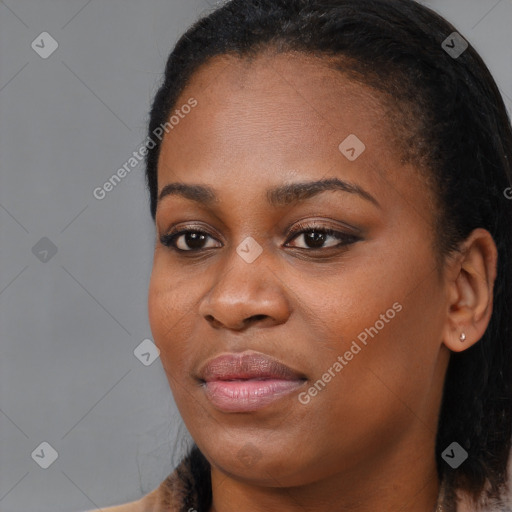 Joyful black young-adult female with medium  black hair and brown eyes