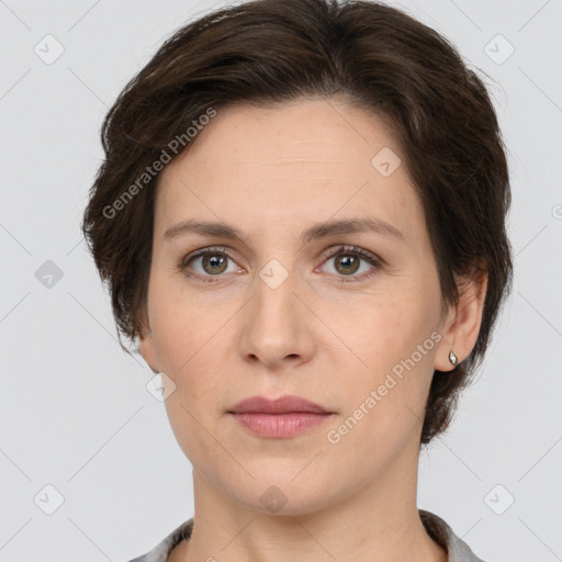 Joyful white adult female with short  brown hair and brown eyes