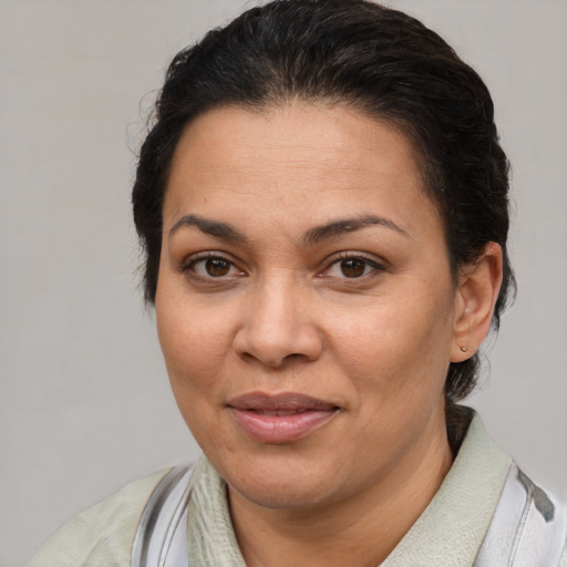 Joyful white adult female with short  brown hair and brown eyes