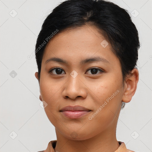 Joyful latino young-adult female with short  brown hair and brown eyes