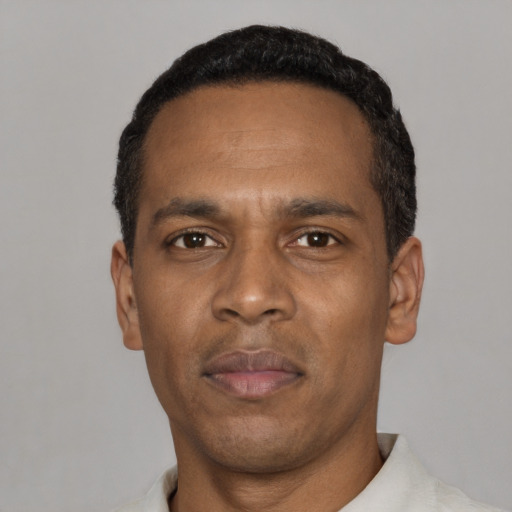 Neutral black adult male with short  black hair and brown eyes