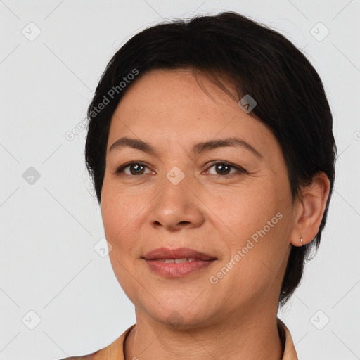 Joyful white adult female with short  brown hair and brown eyes