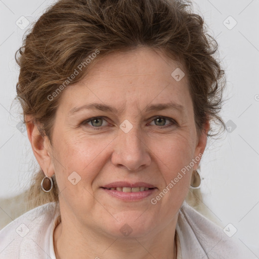 Joyful white adult female with short  brown hair and grey eyes