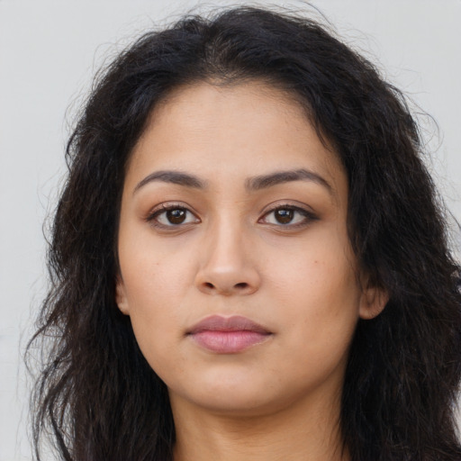 Neutral latino young-adult female with long  brown hair and brown eyes