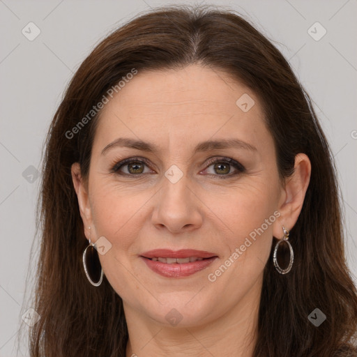 Joyful white adult female with long  brown hair and grey eyes