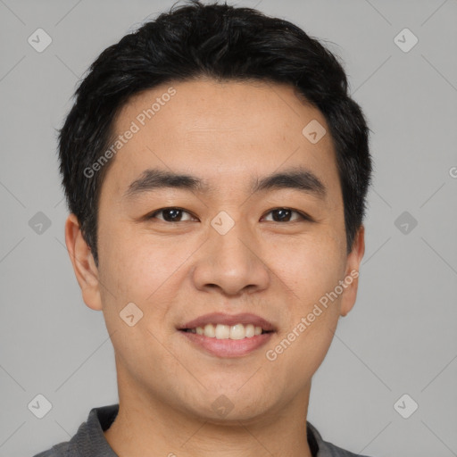 Joyful asian young-adult male with short  black hair and brown eyes