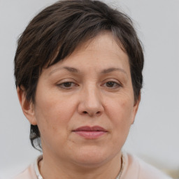 Joyful white adult female with short  brown hair and brown eyes