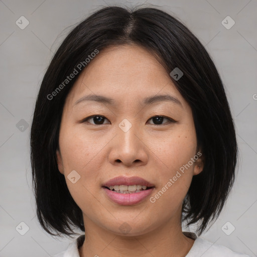 Joyful asian young-adult female with medium  brown hair and brown eyes