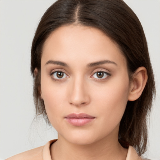 Neutral white young-adult female with medium  brown hair and brown eyes